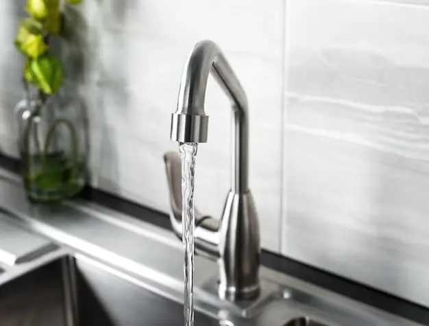 new-modern-steel-faucet-kitchen - water softerner houston